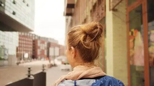 travel on a student budget - girl with hair bun