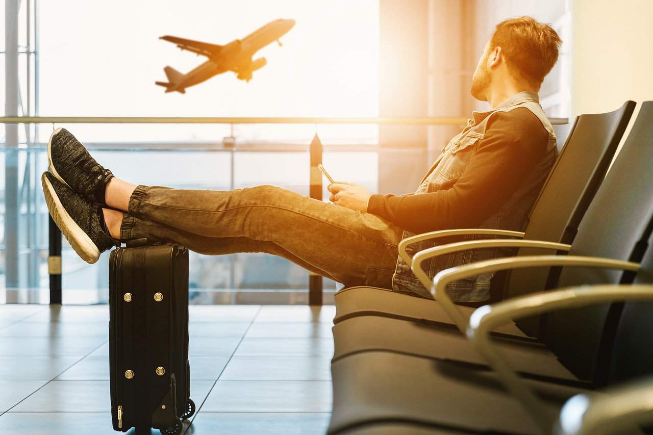 cheap airfare discount flights How to Prepare for an Early Morning Flight- waiting at terminal