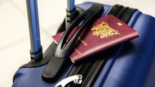 Travel essentials for 2024 - suitcase with passport