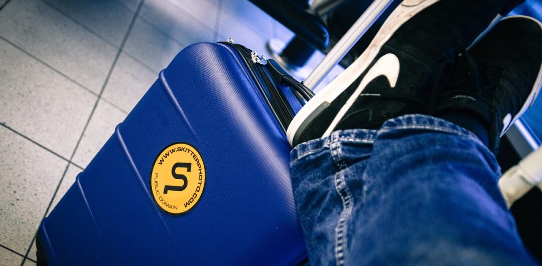 Trouble sleeping when flying tips - shoes on a suitcase