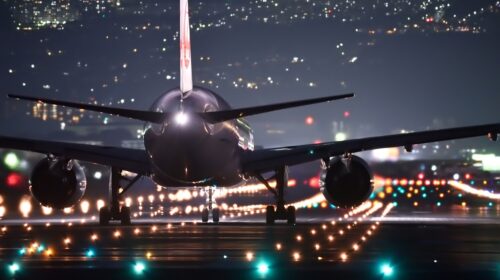 How to Avoid Flight Roaming Fees Top US Airports - airplane at night 6 Best Companies for Airport Transfers