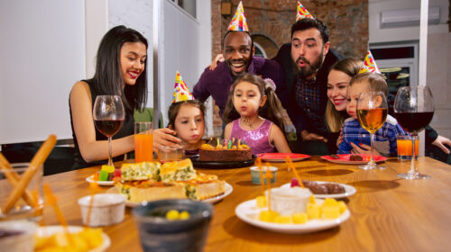 working abroad - Portrait of happy family celebrating a birthday at home