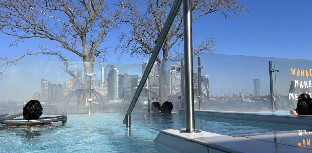 QC NY Spa view of Manhattan from pool