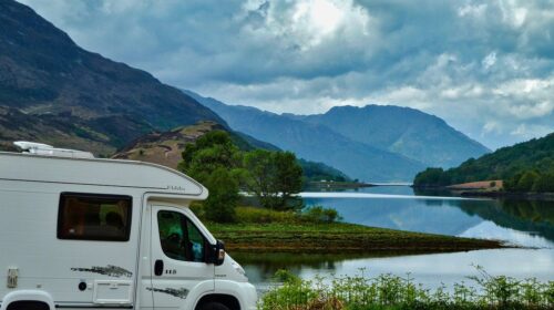 perfect RV adventure - How to Prepare for Your First RV Trip - camper van with mountains Make Your Next RV Adventure Better Than Ever Repair or Sell? The True Cost of a Broken RV