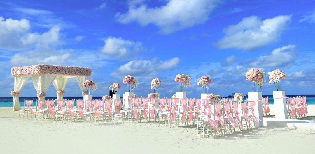 Make Your Destination Wedding Really Shine - beach wedding with chairs set up