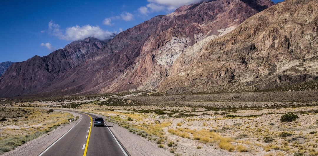 Why the Journey Can Be the Best Part of Traveling - road with mountains feeling of adventure