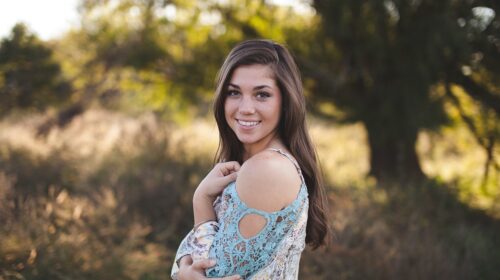 How to Enhance Your Natural Beauty - Want the scoop on how to protect your teeth on the go? Here are easy tips to get you packing! woman in a field