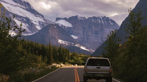 Could A Road Trip Be Your Next Travel Adventure - Car with Mountain View Beginners Guide To Car Fluids What You Need In Your Garage Road Trip Planning: 5 Aspects To Not Overlook The True Cost of Keeping an Old Car with Constant Repairs