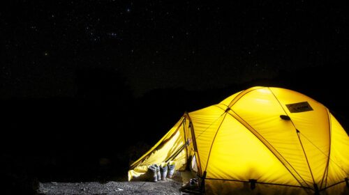 3 Essential Items for Regular Camping - Tent Lit Up at Night 3 Ways to Stay Warm When Camping How Camping Trips Create a More Relaxed Travel Experience