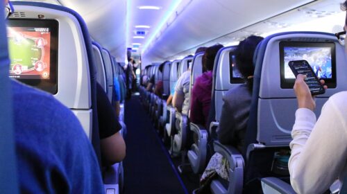 cheap flights - discount airfare How to Avoid Flight Roaming Fees 6 Best Companies for Airport Transfers - Airplane Aisle Preparing For Your Next Trip Abroad Is Easier Than You Think