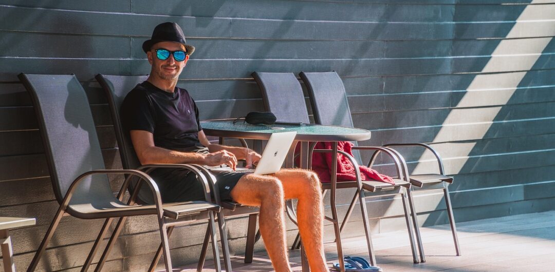 Why Having a Stable Internet Connection is a Must During Your Stay in a Foreign Country 2 Digital Nomads Read This for Tips on How to Work While Adventuring - Man with a Laptop by a Pool How to Keep Your Business Running While You Travel
