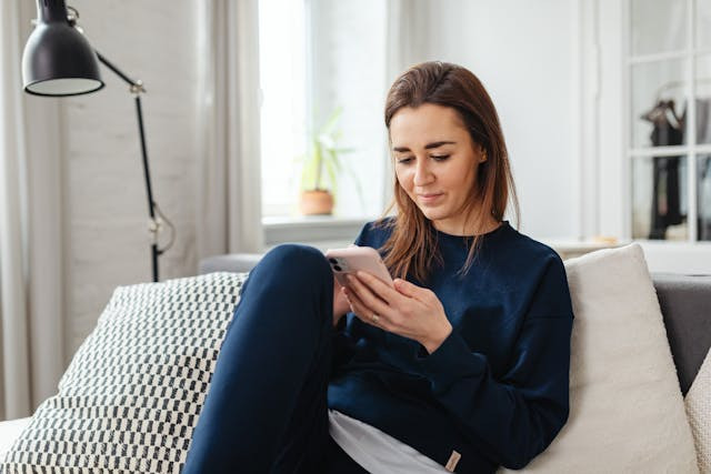 Online Card Games: Five Benefits You Need to Know About - Woman on Her Phone

How Digital Entertainment Is Reshaping the Modern Staycation Experience