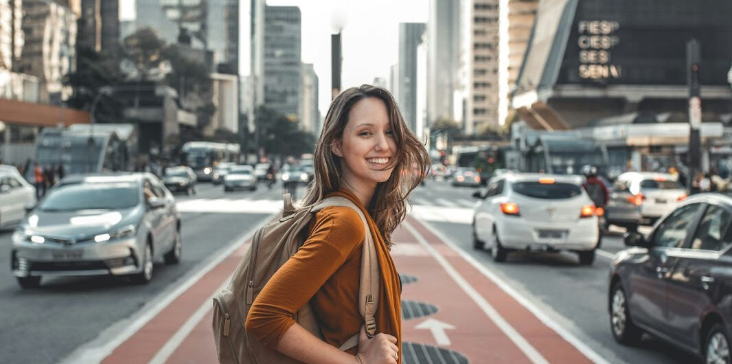 How to Find Vacation Value Without Settling for a Boring Trip 8 Why Some of the Best Travel Moments Aren’t Planned - Woman in City
How to Find Vacation Value Without Settling for a Boring Trip