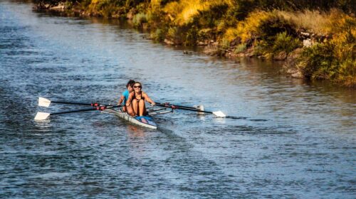 Dive Into These 3 US Cities If You Love Water Sports - Women in a Row Boat 4 Reasons Why the Best Trips Leave You Feeling Different