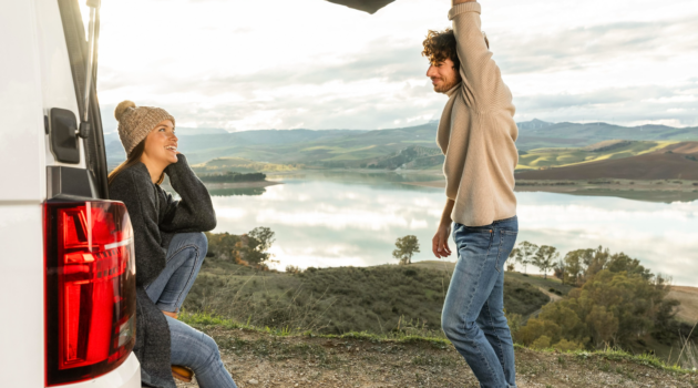 Homepage 4 Family Snack Box Road Trip Planning: 5 Aspects To Not Overlook - Couple Hanging Out in the Back of Van Why Road Trips Make Amazing Weekend Resets