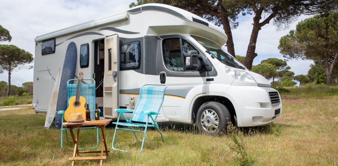 Going on an RV Trip for the First Time? Here's What you Need to Know - RV with Chairs and Guitar

3 Reasons An RV Is The Best Travel Purchase You'll Ever Make