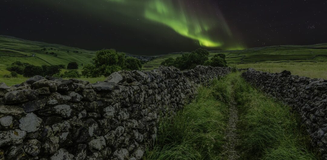 Why Hotels in Yorkshire Offer Unbeatable Value for Travelers - Aurora Borealis Above a Stone Wall