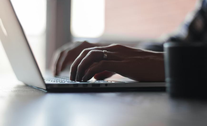Honest Review of Gammill Law Accident & Injury Lawyers 2026 - Hands typing on Laptop Keyboard