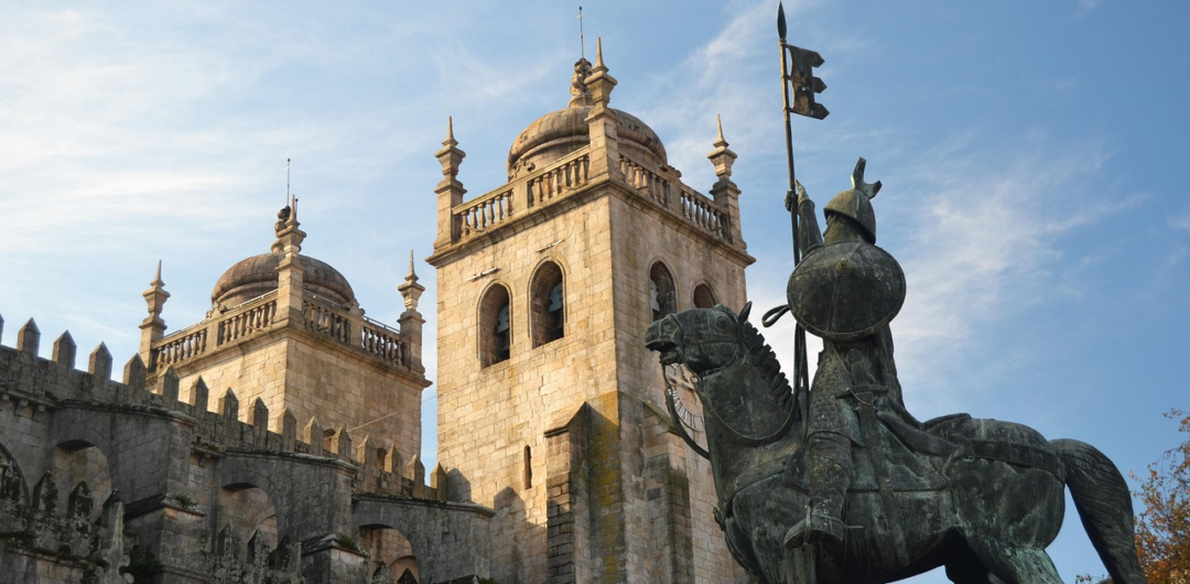 A cathedral and statue in Porto.