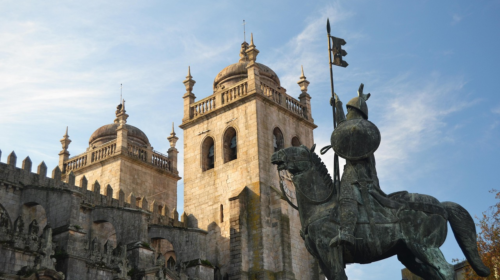 A cathedral and statue in Porto.