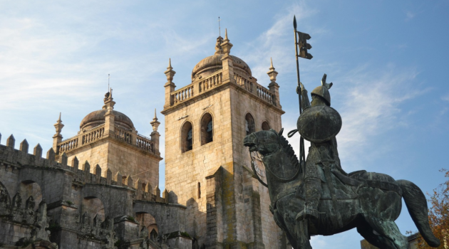 A cathedral and statue in Porto.