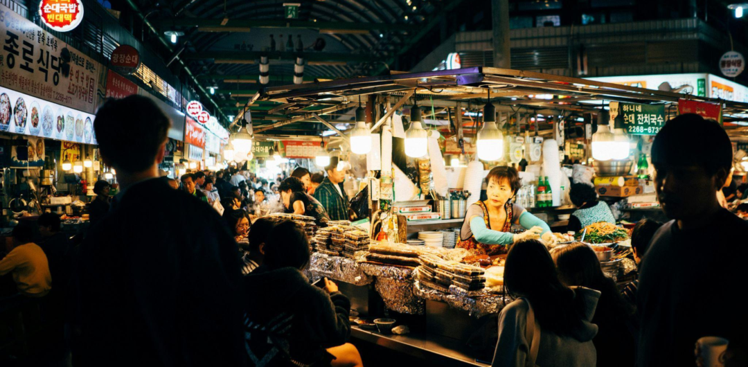 Food-Focused Travel: How to Find Local Flavor Without Over-planning 6 Food-Focused Travel: How to Find Local Flavor Without Overplanning - People Inside South Korean Food Market